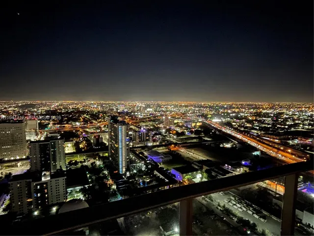 a swimming pool with outdoor seating and yard
