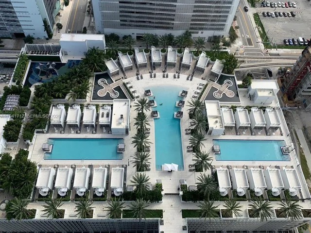 a view of a swimming pool and a yard