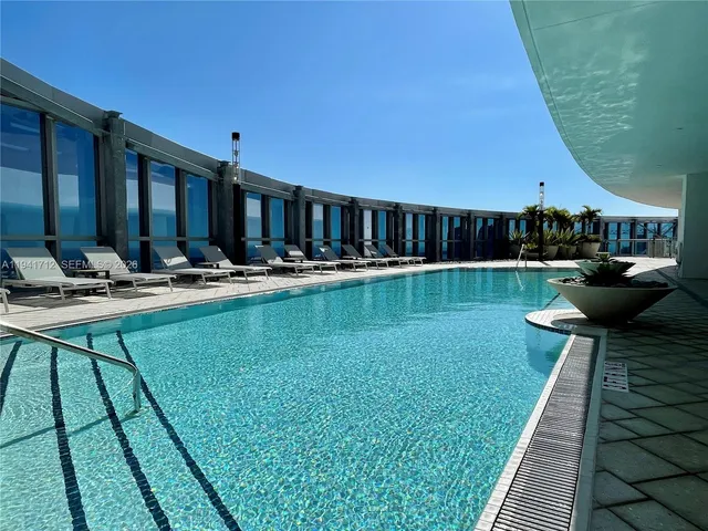 a view of a patio with a table and chairs