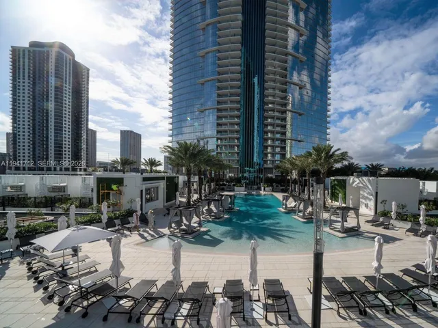 a bathroom with a shower and a glass door