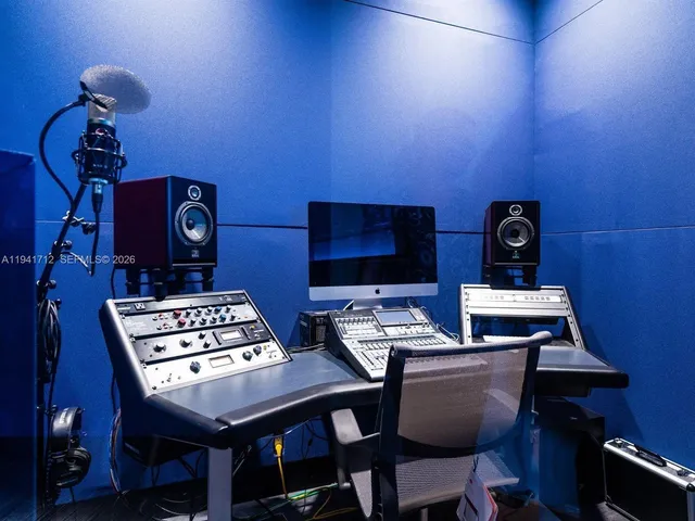 a tennis court with view of buildings