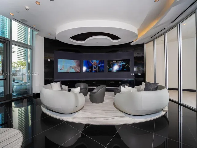 a view of swimming pool with outdoor seating