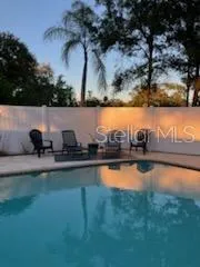 a kitchen with stainless steel appliances a stove refrigerator sink and microwave