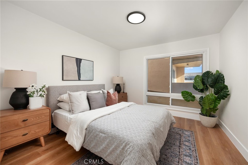 1010 Palm Avenue, Unit 207 West Hollywood, CA 90069 - Photo 13 of 21 a bed room with a bed and a potted plant