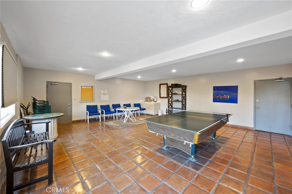 1010 Palm Avenue, Unit 207 West Hollywood, CA 90069 - Photo 15 of 21 a living room with furniture a table and a pool table