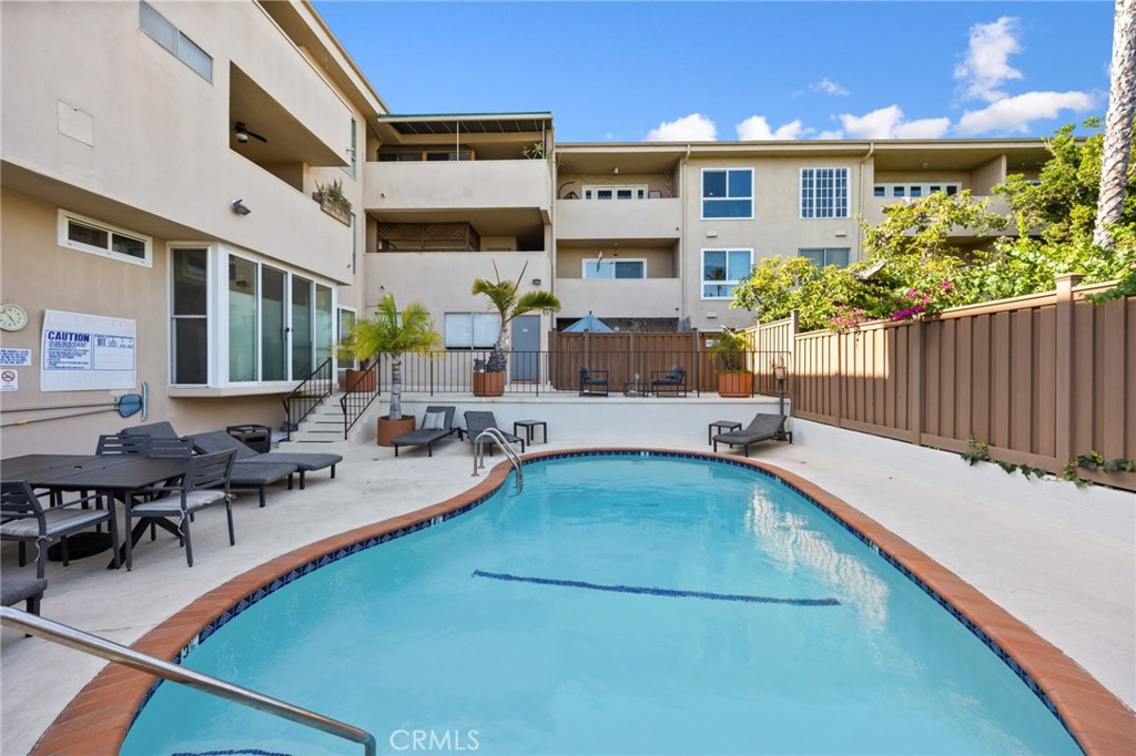 1010 Palm Avenue, Unit 207 West Hollywood, CA 90069 - Photo 16 of 21 a view of a swimming pool with outdoor seating