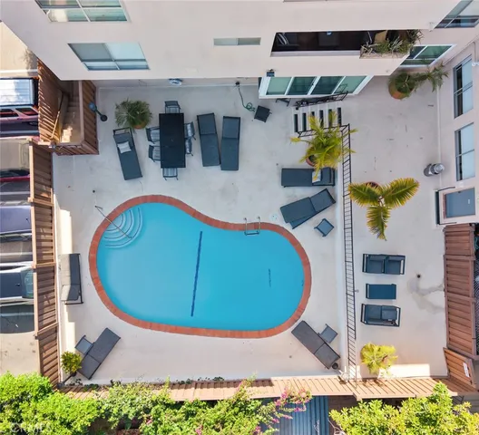 an aerial view of a house with swimming pool