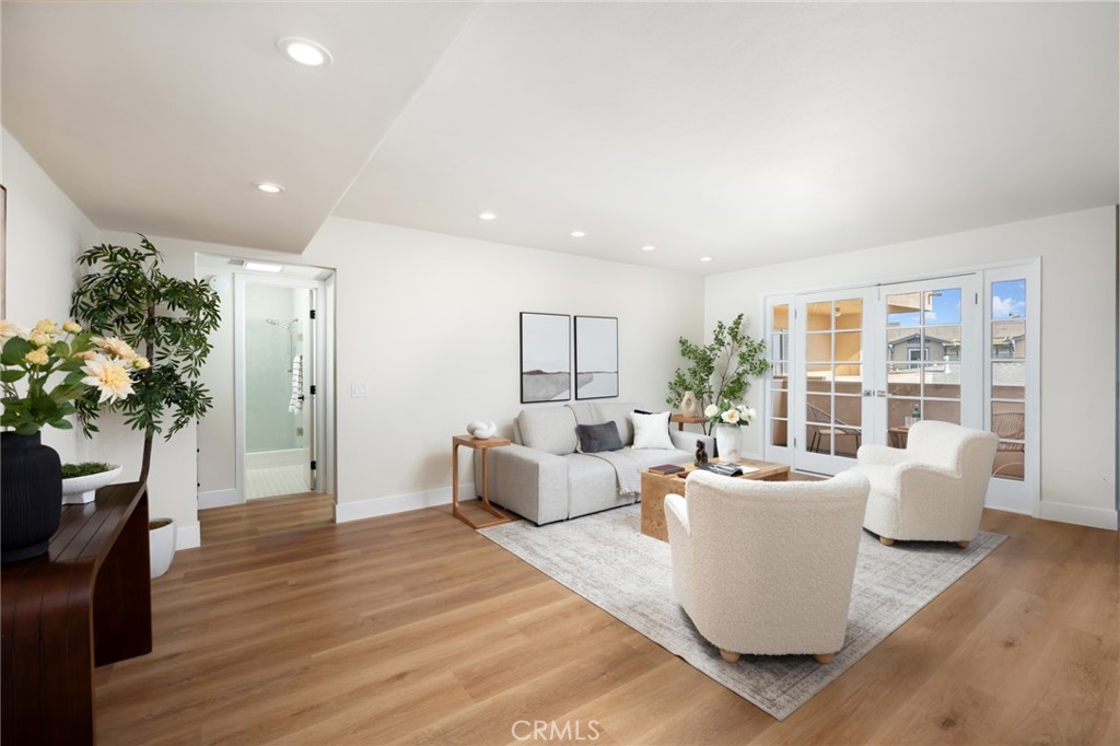 1010 Palm Avenue, Unit 207 West Hollywood, CA 90069 - Photo 6 of 21 a living room with furniture a potted plant and wooden floor