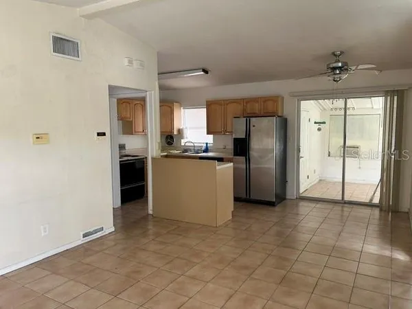 a kitchen with stainless steel appliances a refrigerator and a sink