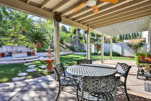 a view of yard with patio