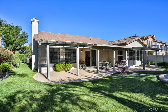 a view of a backyard with sitting area