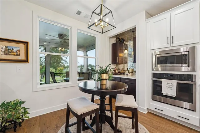 a dining room with furniture and window