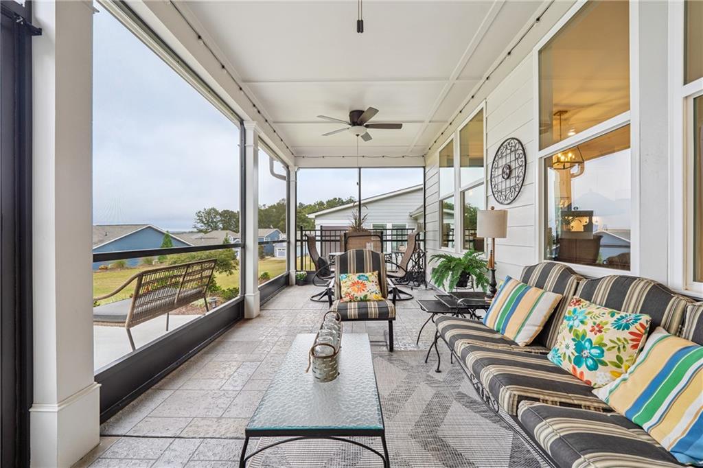 103 Rabun Court Hoschton, GA 30548 - Photo 19 of 22 a living room with furniture and a large window