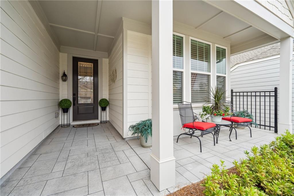 103 Rabun Court Hoschton, GA 30548 - Photo 2 of 22 a view of a porch with chairs