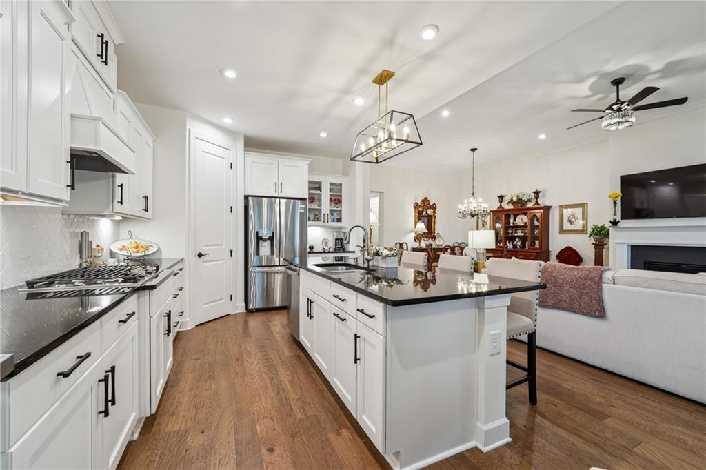 103 Rabun Court Hoschton, GA 30548 - Photo 10 of 22 a kitchen with stainless steel appliances a sink stove and refrigerator