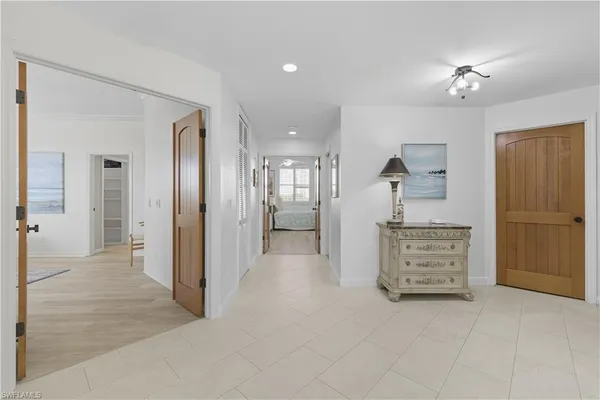 wooden floor in an empty room and a ceiling fan