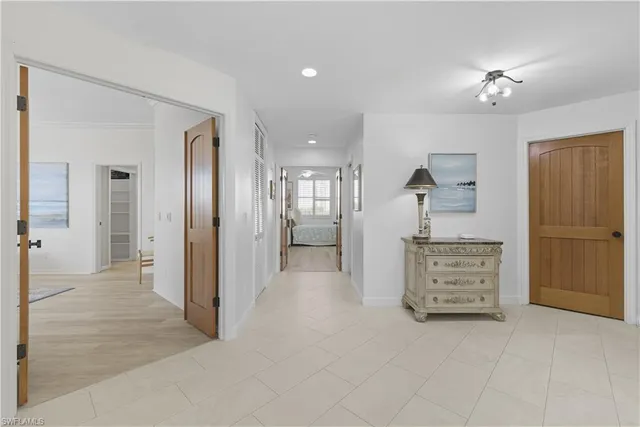 wooden floor in an empty room and a ceiling fan