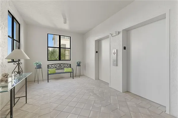 a spacious bedroom with a bed and a window