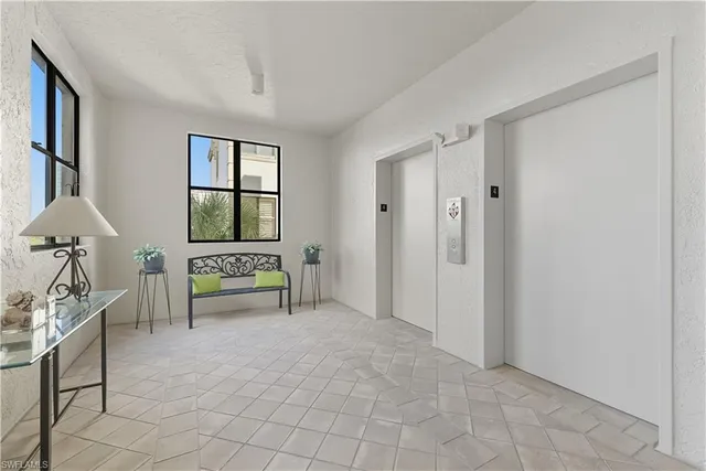 a spacious bedroom with a bed and a window