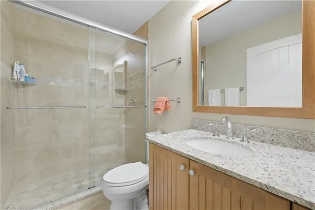 a bedroom with a bed and chair