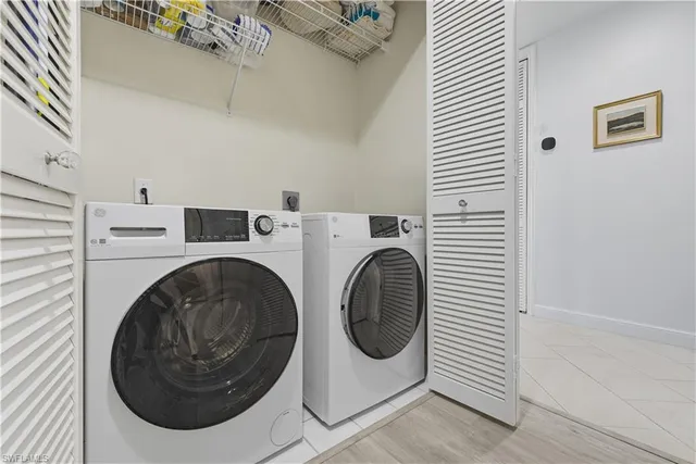 a bedroom with furniture and a chandelier
