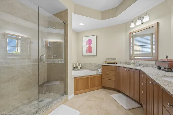 a bathroom with a granite countertop sink a toilet and a mirror