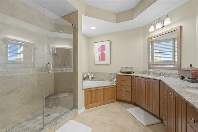 a bathroom with a granite countertop sink a toilet and a mirror