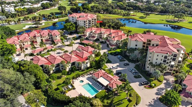 an aerial view of residential house with outdoor space and lake view