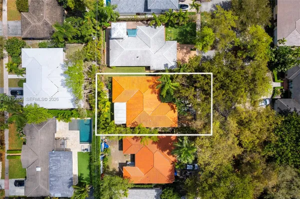 an aerial view of houses with yard