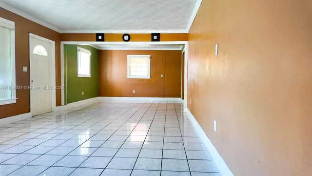 a view of hallway with wooden floor