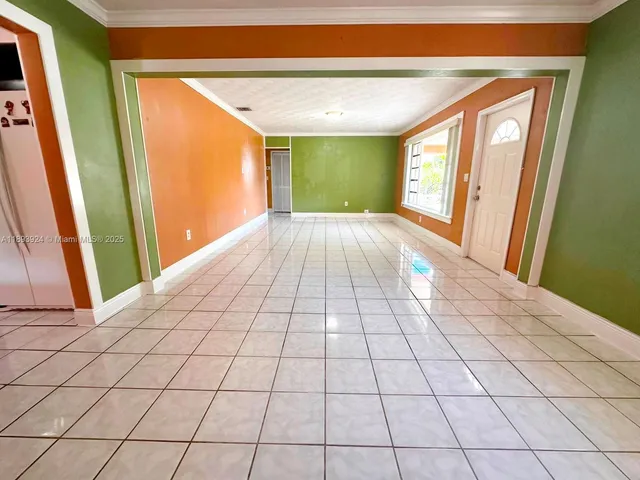 a view of an empty room and window