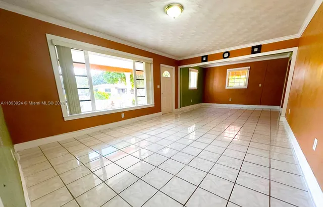 a view of an empty room and window