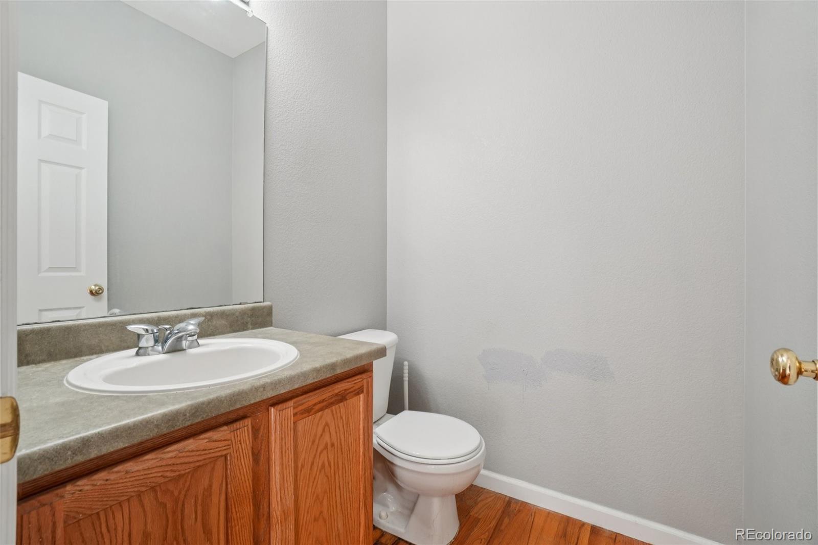 11205 Coal Ridge Street Firestone, CO 80504 - Photo 13 of 40 a bathroom with a sink and a toilet