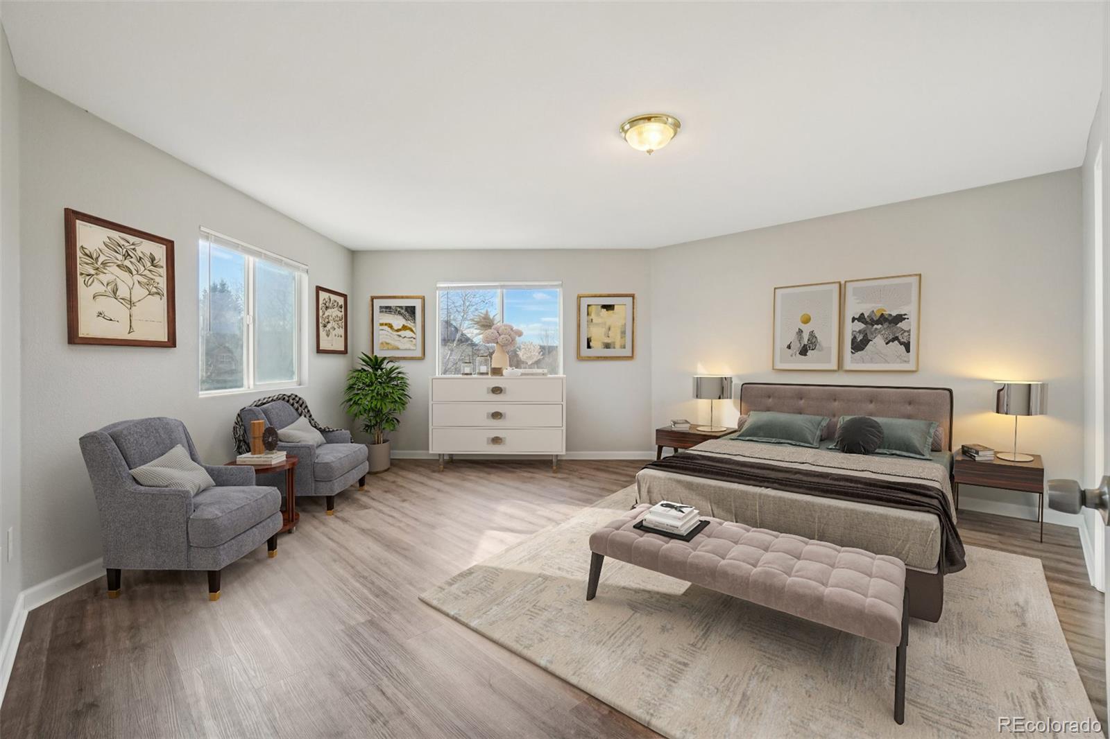 11205 Coal Ridge Street Firestone, CO 80504 - Photo 20 of 40 a bedroom with furniture and a wooden floor