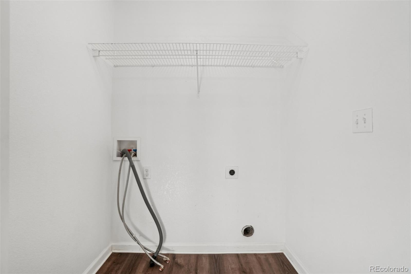 11205 Coal Ridge Street Firestone, CO 80504 - Photo 25 of 40 a view of a room with rack on the wall