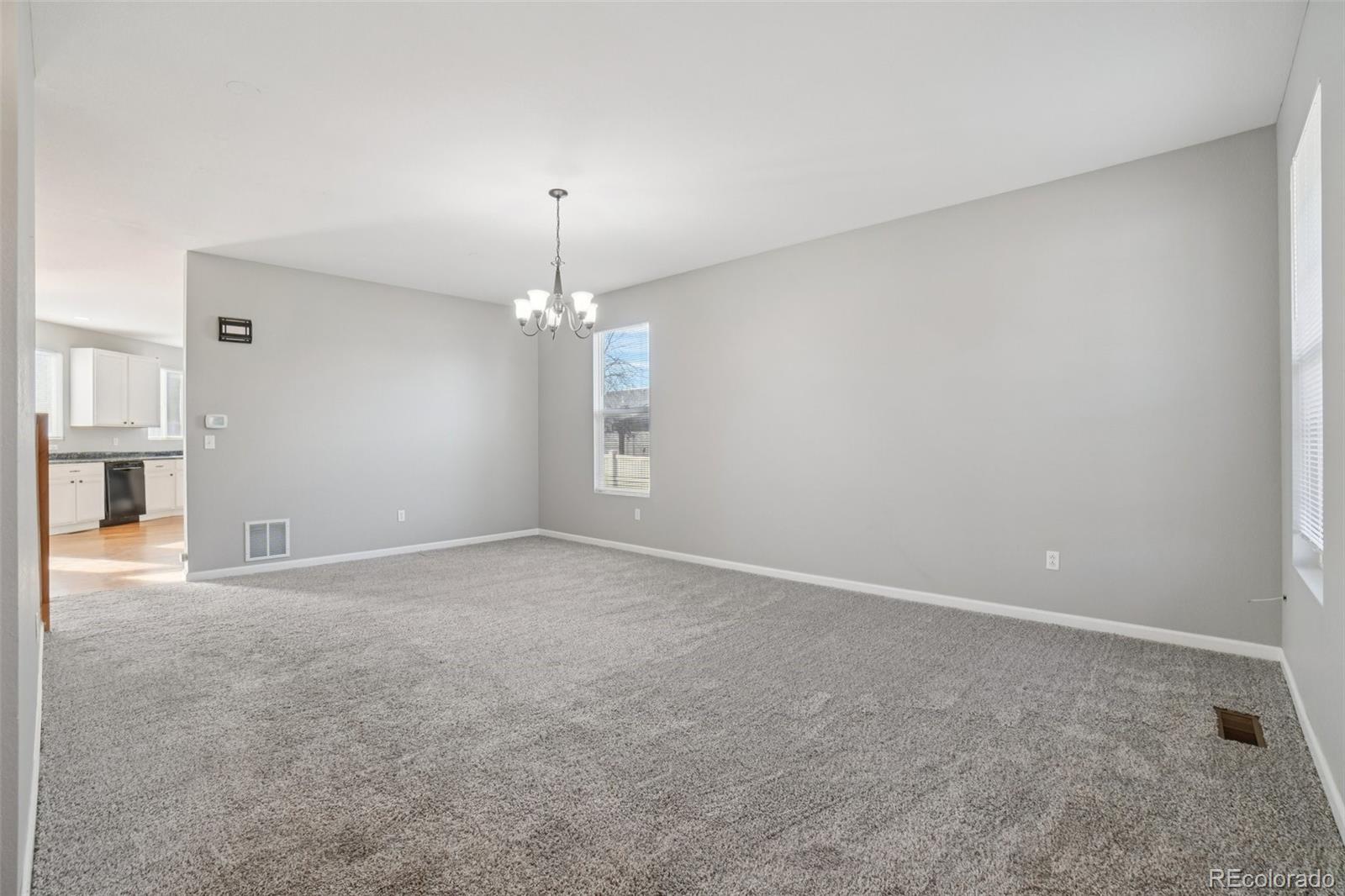 11205 Coal Ridge Street Firestone, CO 80504 - Photo 4 of 40 a view of empty room with window