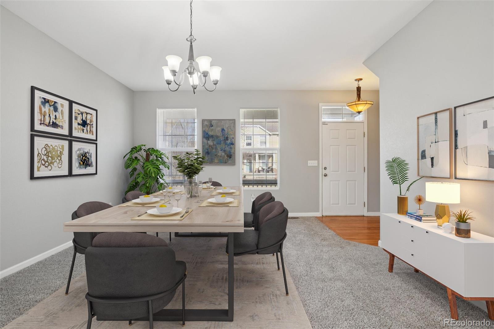 11205 Coal Ridge Street Firestone, CO 80504 - Photo 5 of 40 a view of a dining room with furniture and chandelier