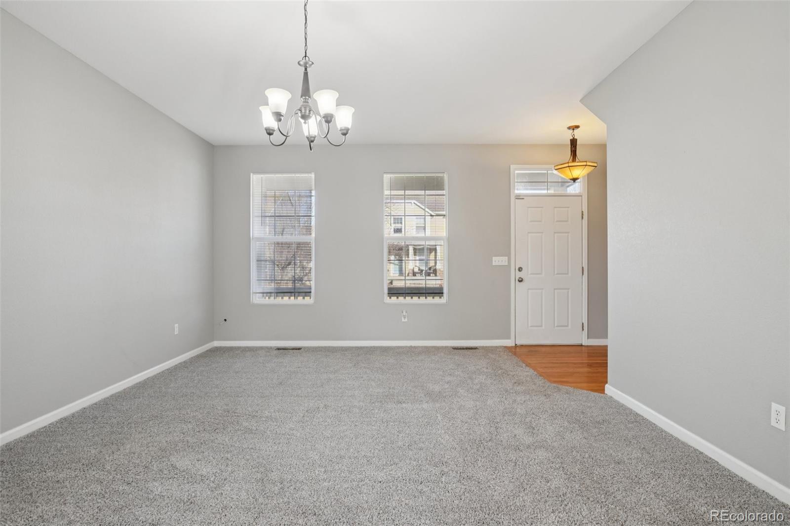 11205 Coal Ridge Street Firestone, CO 80504 - Photo 6 of 40 a view of an empty room with window