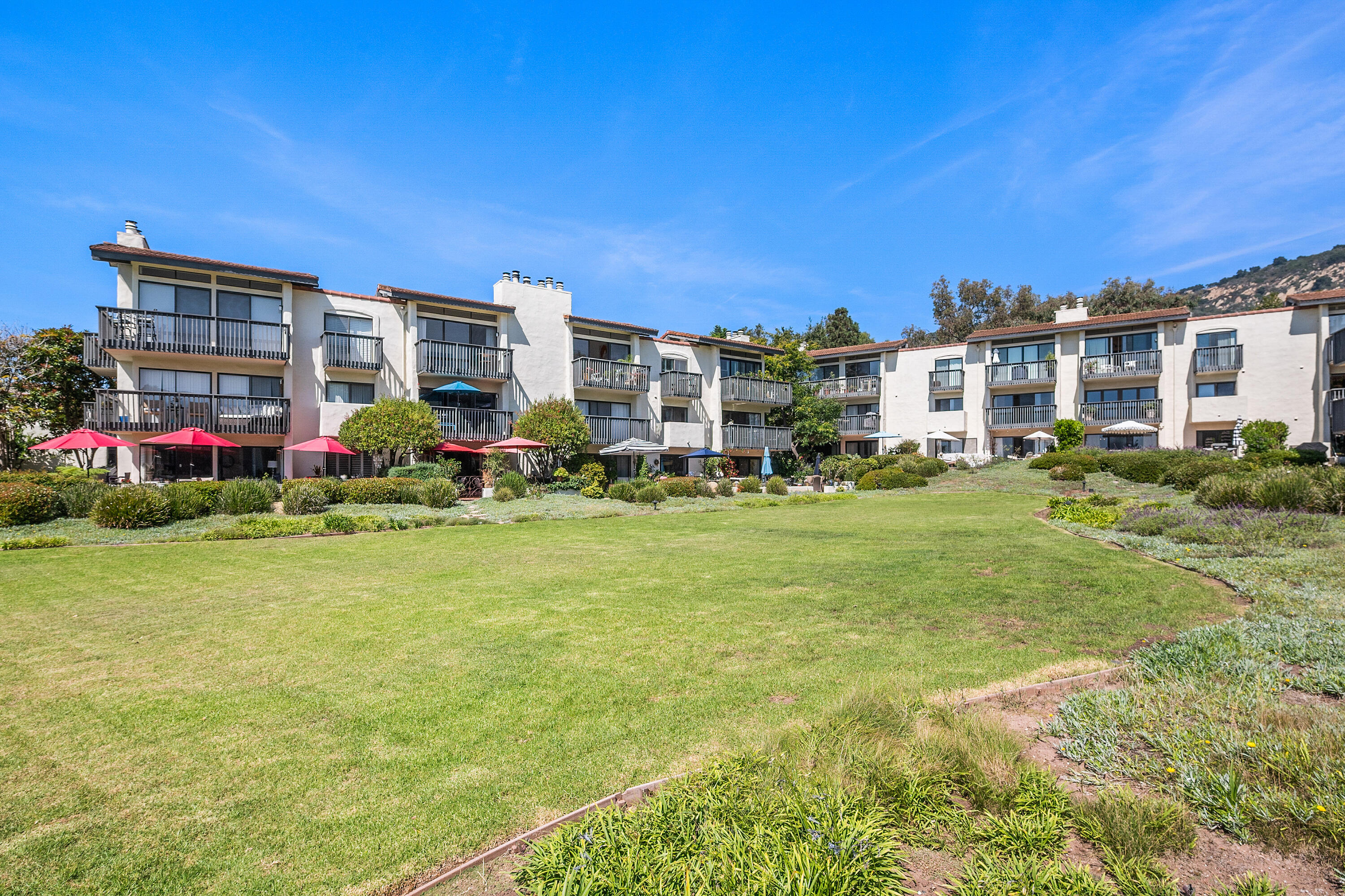 3375 Foothill Road, Unit 412 Carpinteria, CA 93013 - Photo 22 of 22 a front view of building with play ground and trees