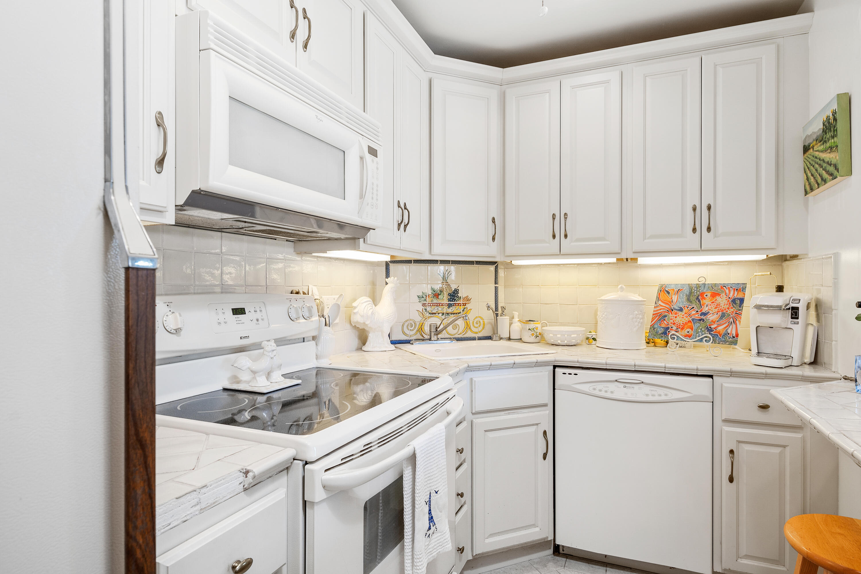 3375 Foothill Road, Unit 412 Carpinteria, CA 93013 - Photo 5 of 22 a kitchen with cabinets appliances a sink and a cabinets