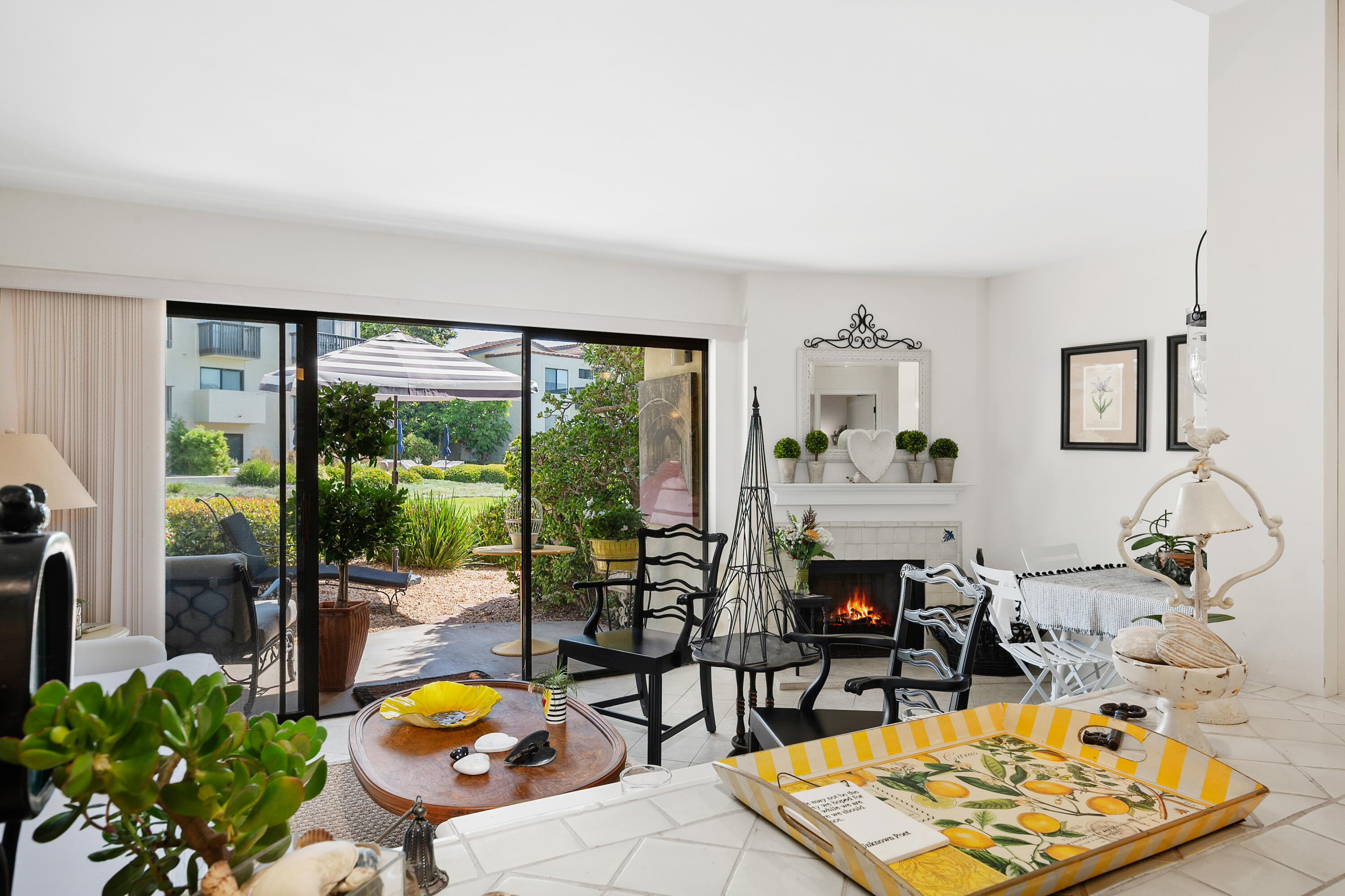 3375 Foothill Road, Unit 412 Carpinteria, CA 93013 - Photo 7 of 22 a living room with furniture and a floor to ceiling window