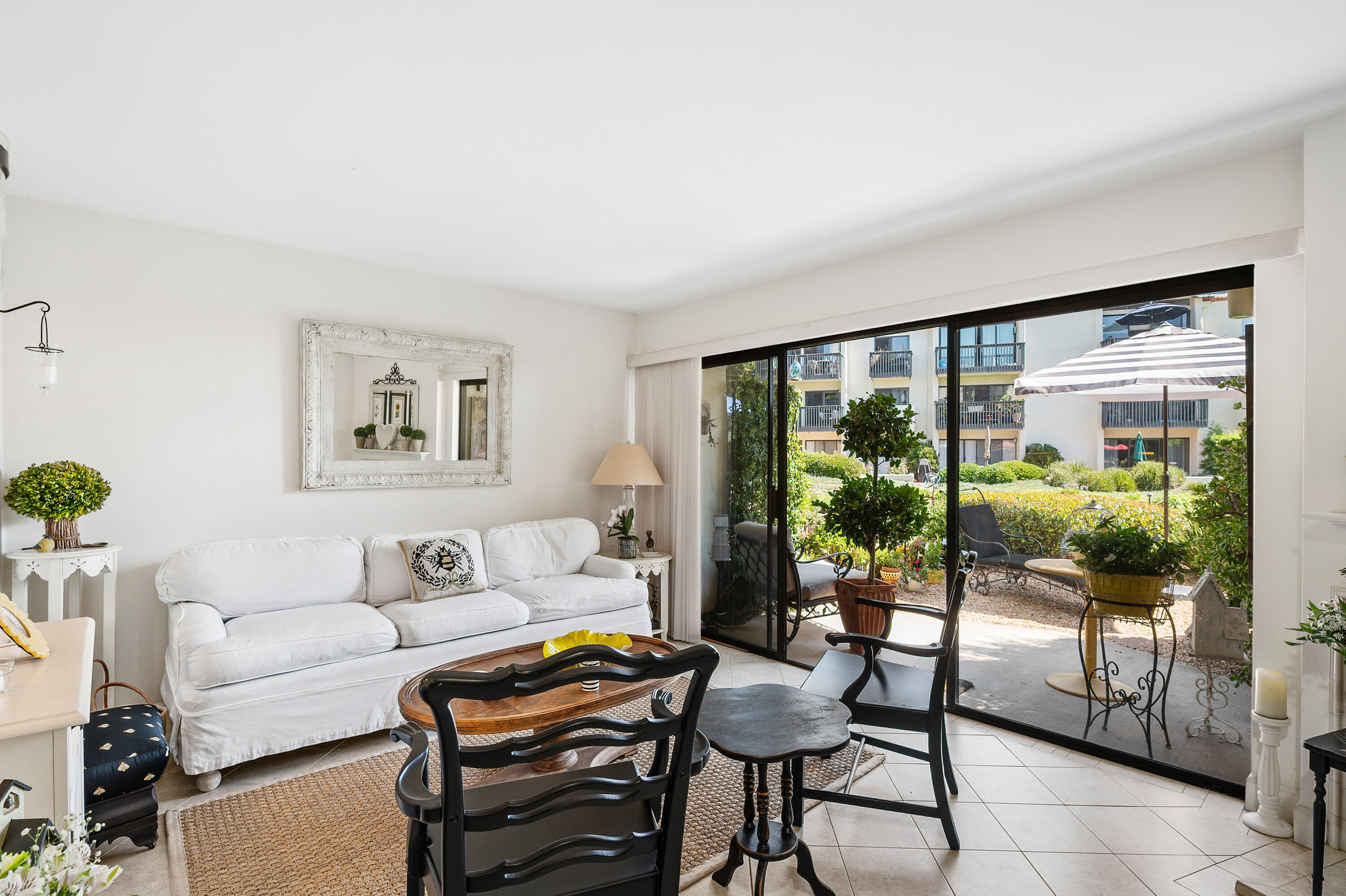 3375 Foothill Road, Unit 412 Carpinteria, CA 93013 - Photo 8 of 22 a living room with furniture and a large window