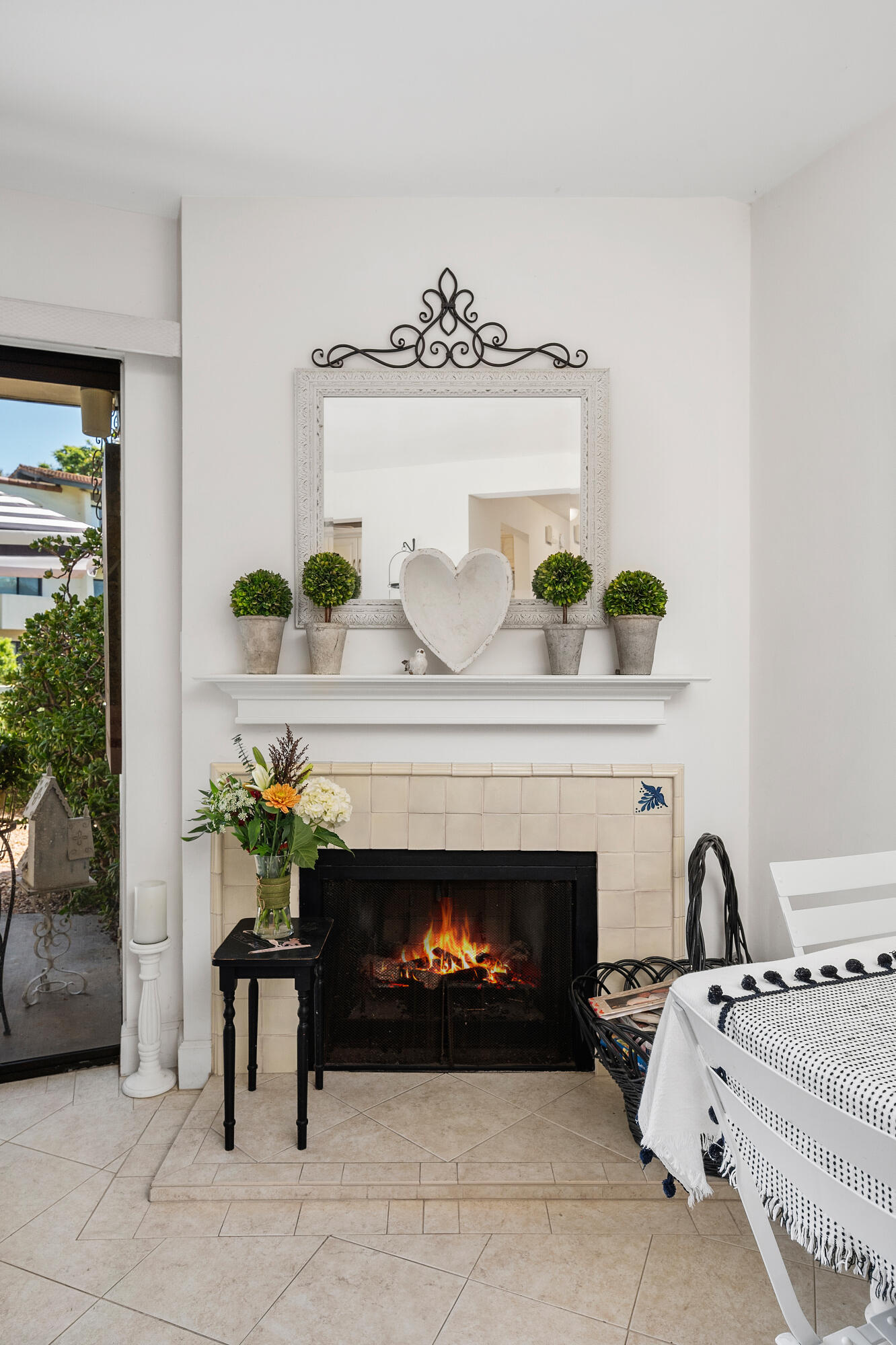 3375 Foothill Road, Unit 412 Carpinteria, CA 93013 - Photo 10 of 22 a living room with furniture a fireplace and a potted plant