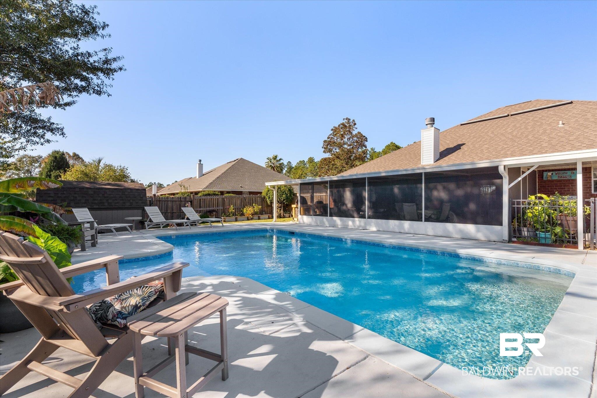 356 Collinwood Loop Foley, AL 36535 - Photo 4 of 21 View of pool featuring a sunroom and a patio area