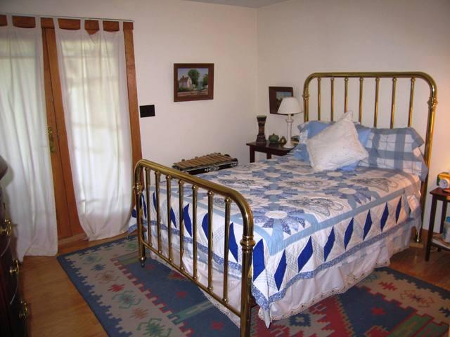 99 Hupi Road Monterey, MA 01245 - Photo 17 of 20 a bedroom with a bed and a window