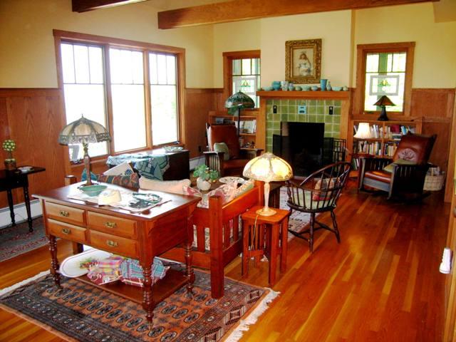 99 Hupi Road Monterey, MA 01245 - Photo 4 of 20 a dining room with furniture a fireplace and wooden floor