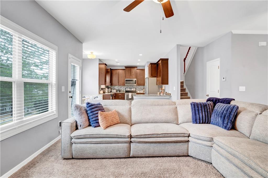 7789 Village Pass Fairburn, GA 30213 - Photo 11 of 35 a living room with furniture and a large window