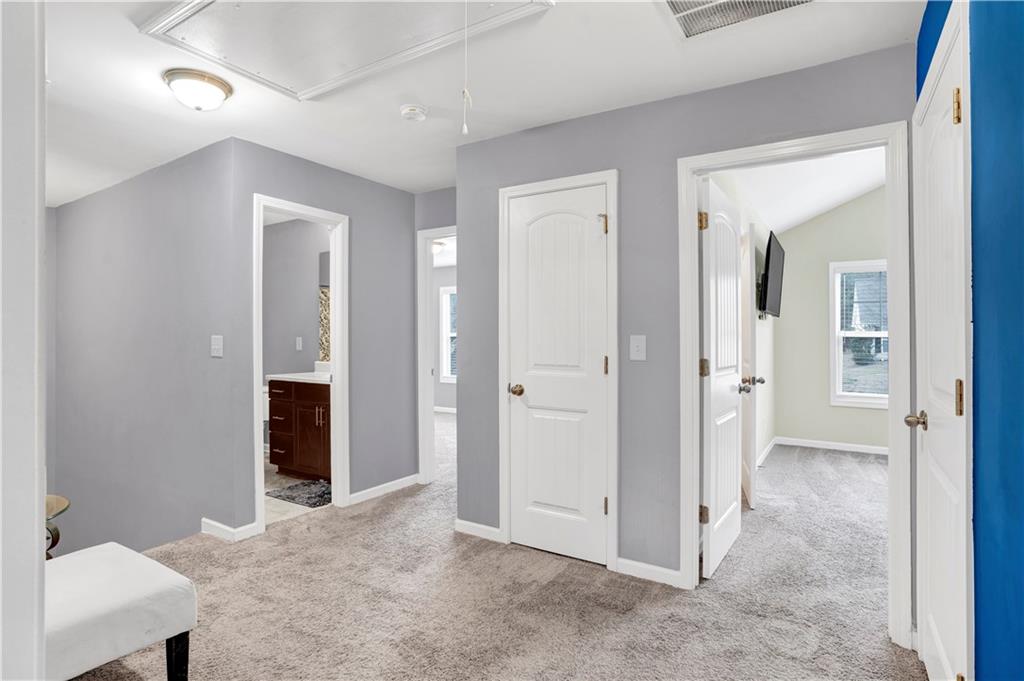 7789 Village Pass Fairburn, GA 30213 - Photo 23 of 35 wooden floor and closet in a room