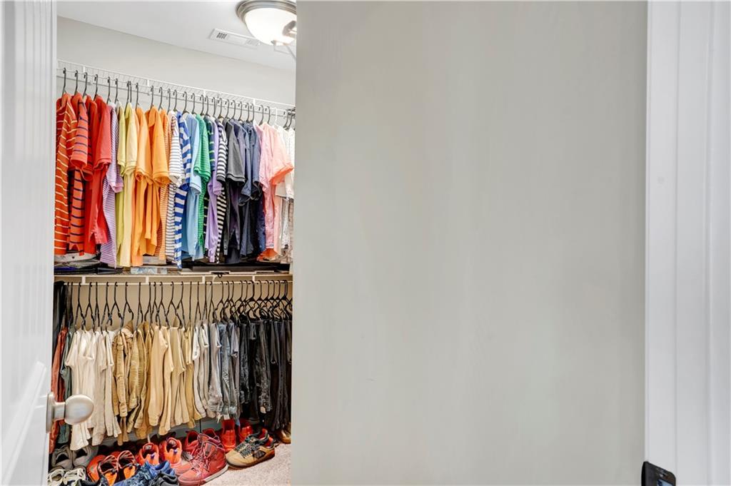 7789 Village Pass Fairburn, GA 30213 - Photo 28 of 35 a view of front door with clothes