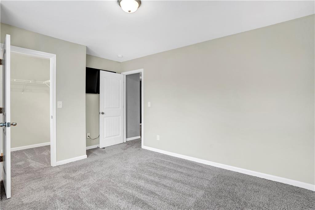 7789 Village Pass Fairburn, GA 30213 - Photo 31 of 35 an empty room with closet area